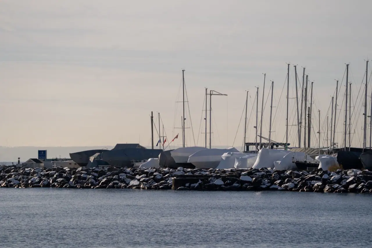 Snow on boats and masts at an Oakville marina in winter