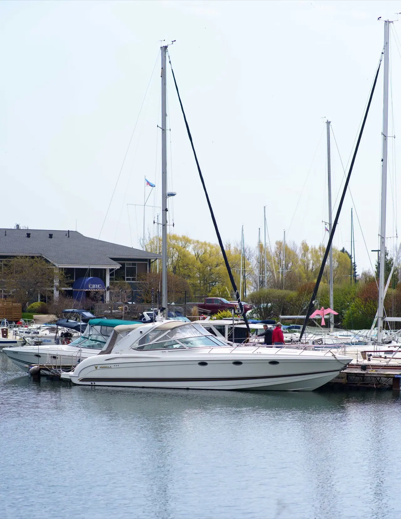 A motor yacht in its slip at a Toronto marina in spring